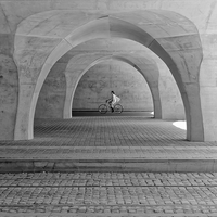 cyclists under the arches