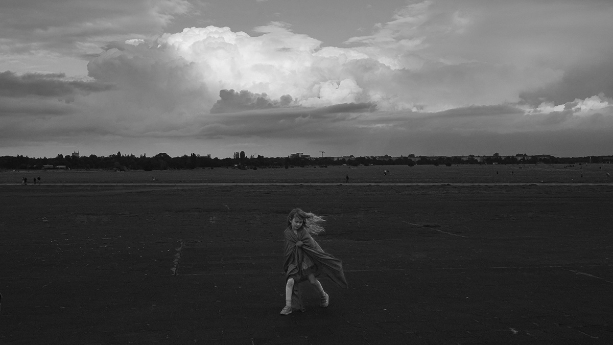 the girl beneath the petals of clouds