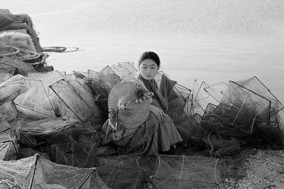 A fisherwoman by the sea